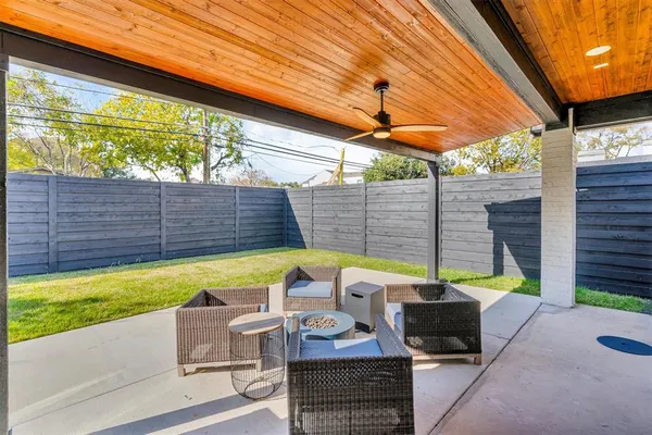 a view of an outdoor sitting area with furniture