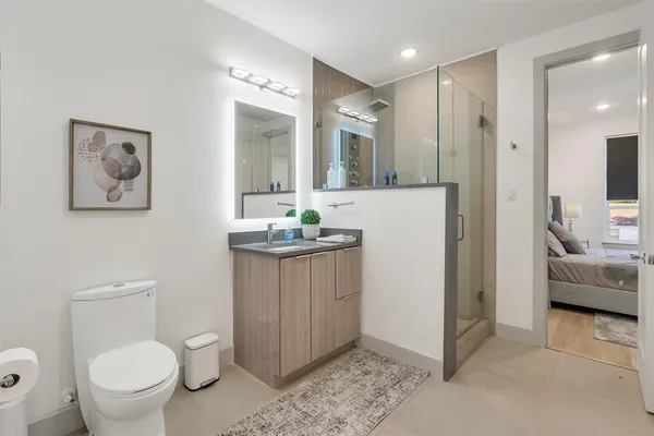 a bedroom with a bed and a cabinets