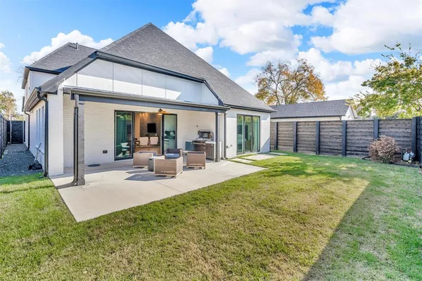 a view of a house with backyard porch and patio