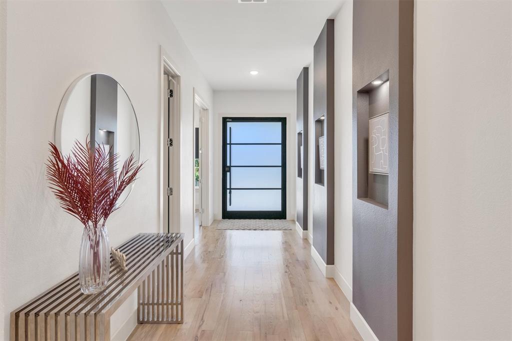 7519 Robin Road Dallas, TX 75209 - Photo 5 of 40 Corridor with baseboards and light wood-style floors