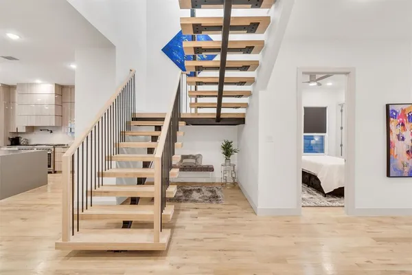 a view of entryway and hall with wooden floor