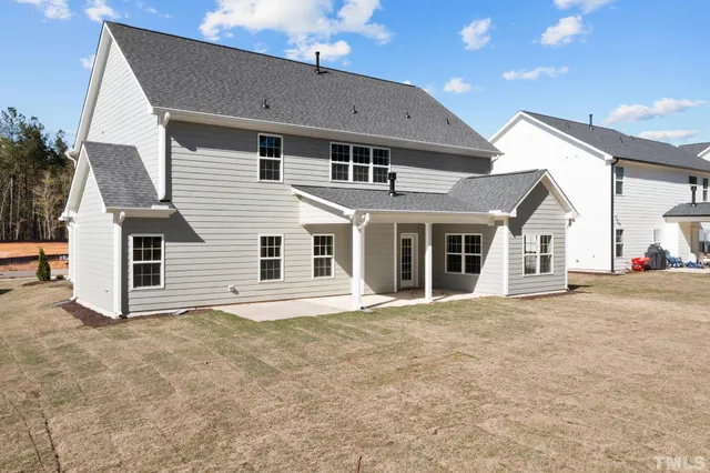 a front view of a house with a garage