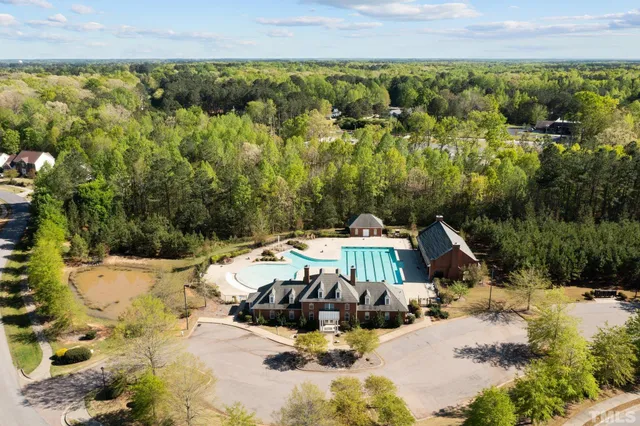 a view of a swimming pool with a yard