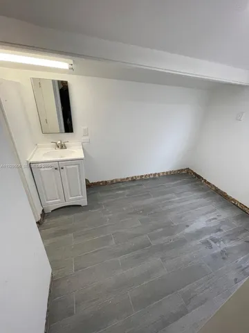 a view of a livingroom with wooden floor