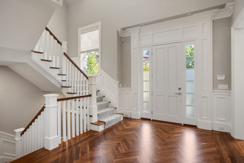 32 Forest Street Lexington, MA 02421 - Photo 13 of 33 a view of entryway with wooden floor and stairs