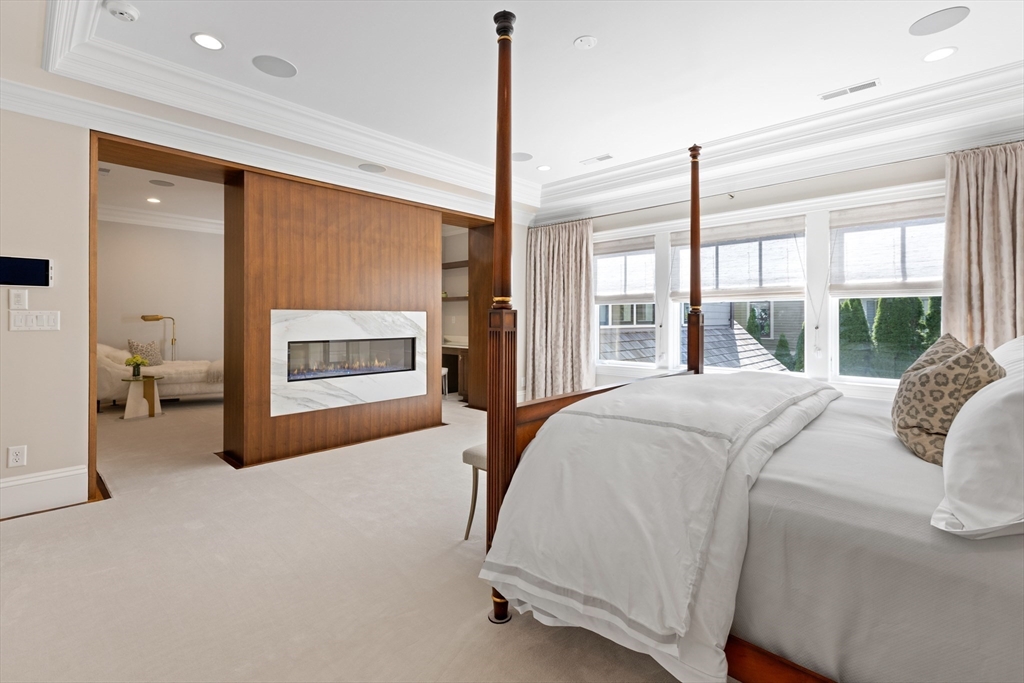 32 Forest Street Lexington, MA 02421 - Photo 14 of 33 a bed sitting in a spacious bedroom next to a window