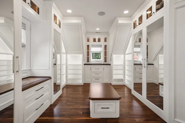a kitchen with stainless steel appliances granite countertop a refrigerator and a stove