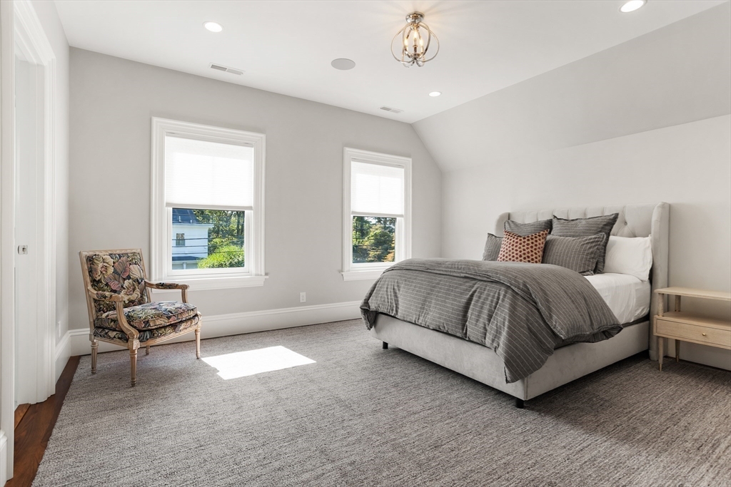 32 Forest Street Lexington, MA 02421 - Photo 19 of 33 a bedroom with a bed and chair