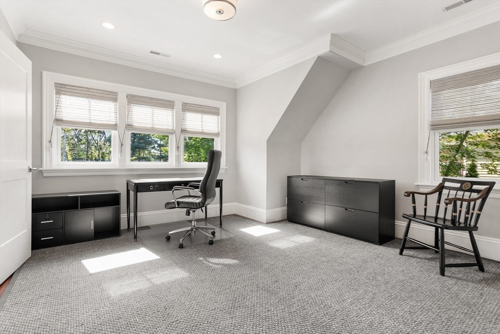 32 Forest Street Lexington, MA 02421 - Photo 21 of 33 a living room with furniture and a window