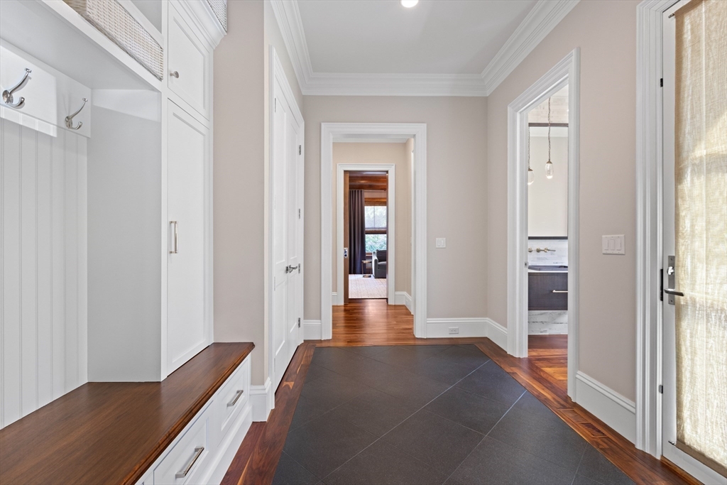 32 Forest Street Lexington, MA 02421 - Photo 27 of 33 a view of a hallway with wooden floor and windows