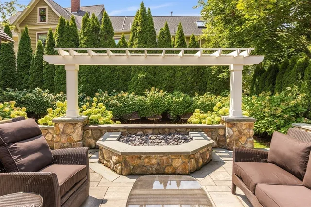a view of a swimming pool with a couches in a patio