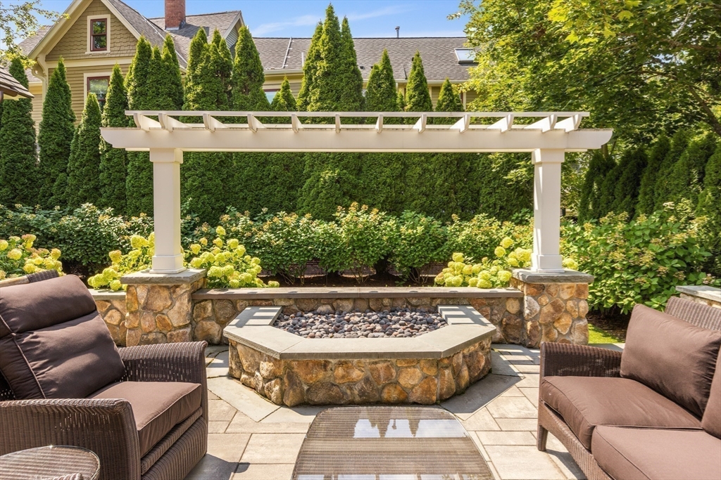 32 Forest Street Lexington, MA 02421 - Photo 32 of 33 a view of a swimming pool with a couches in a patio