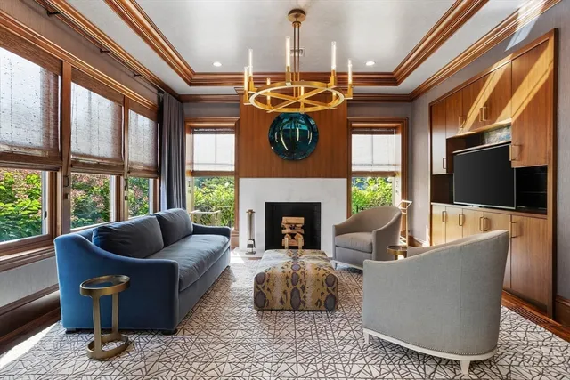 a living room with furniture fireplace and flat screen tv