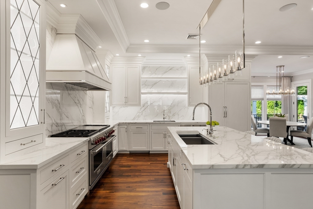 32 Forest Street Lexington, MA 02421 - Photo 8 of 33 a kitchen with stainless steel appliances granite countertop a sink a stove and a refrigerator