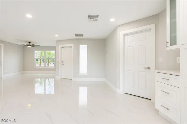 a kitchen with stainless steel appliances a refrigerator sink and microwave