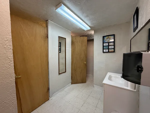 a bedroom with a bed and dresser