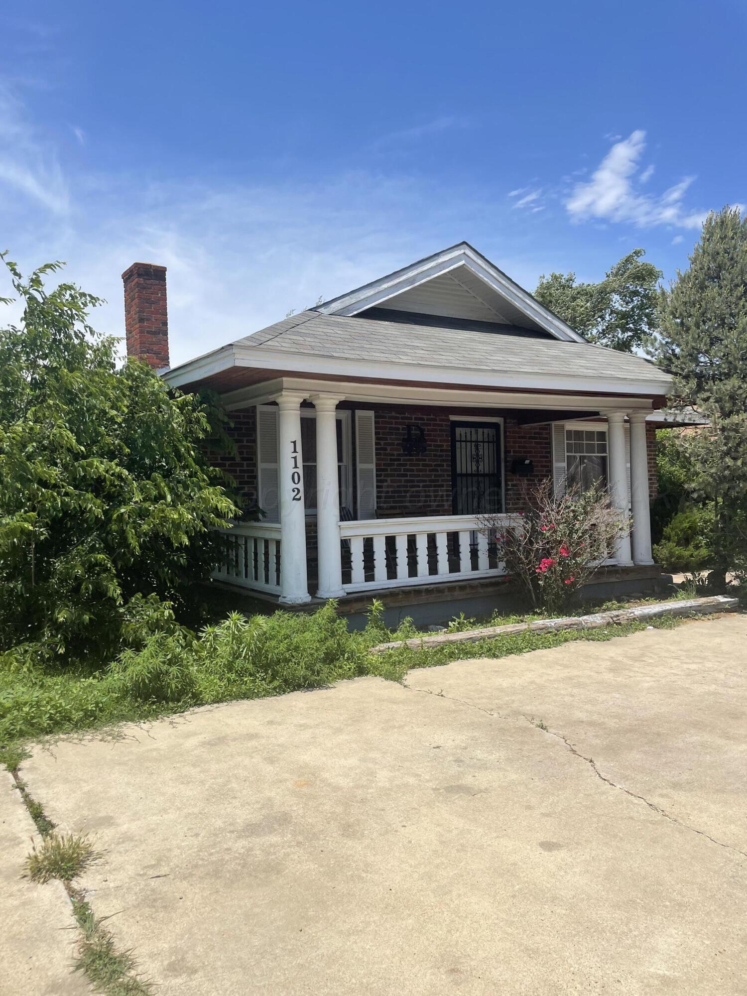 1102 South Western Street Amarillo, TX 79106 - Photo 2 of 9 a front view of a house with a yard