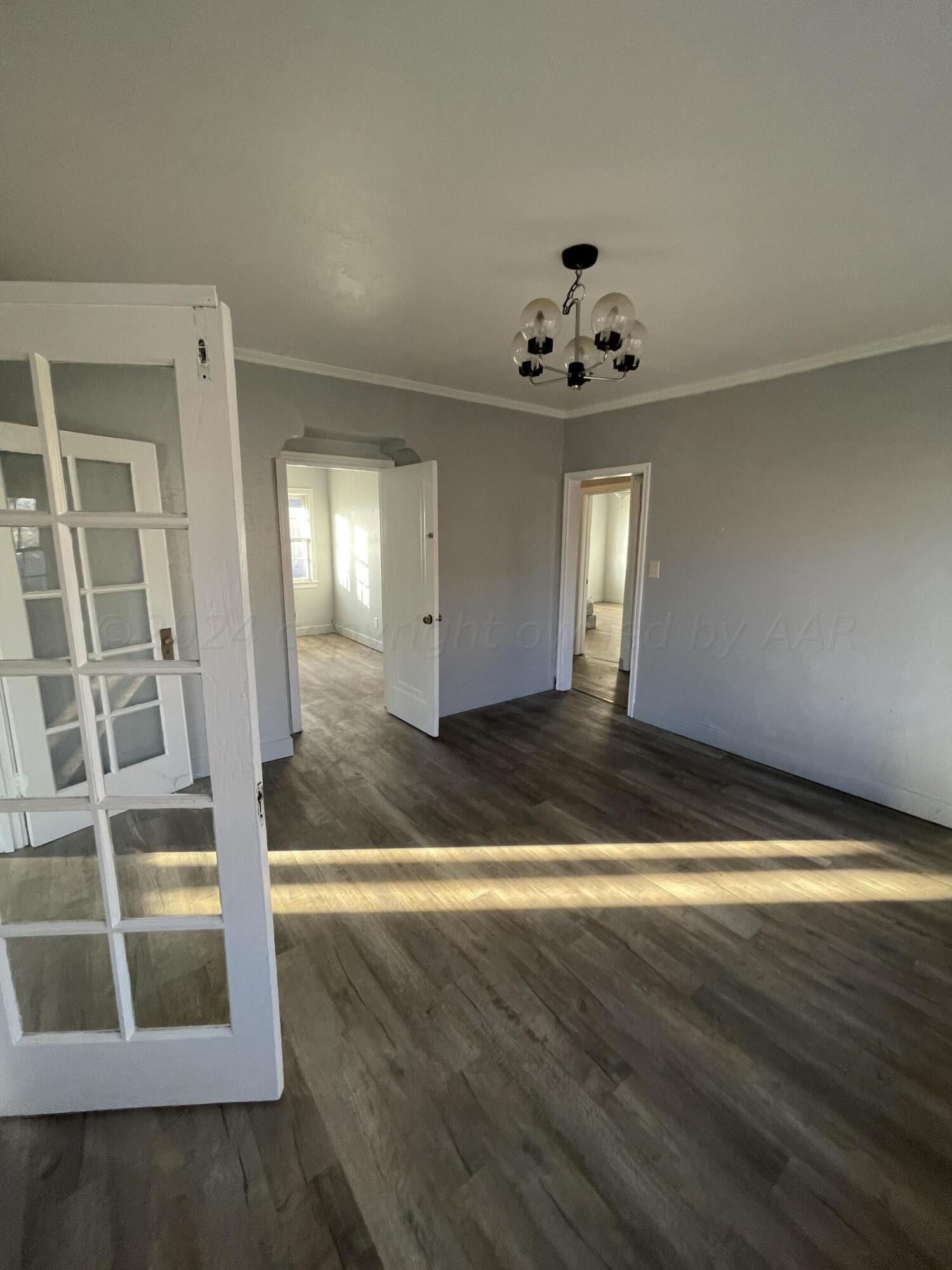 1102 South Western Street Amarillo, TX 79106 - Photo 4 of 9 a view of entryway with wooden floor