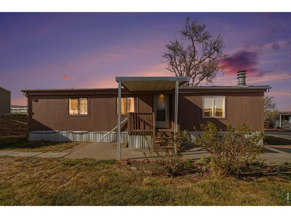 a house with trees in the background