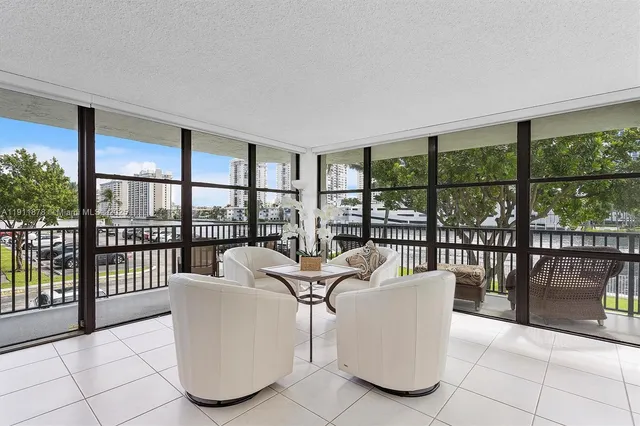a view of a dining room with furniture and a window