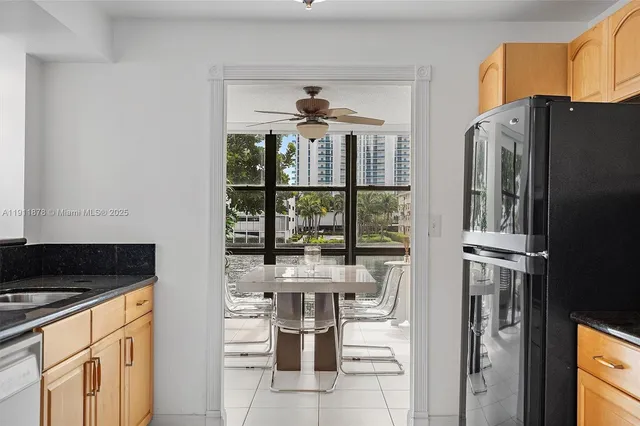 a kitchen with a stove and a refrigerator