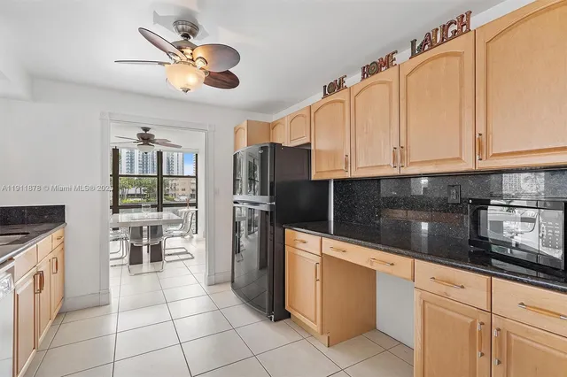 a view of a hallway with closet and a bathroom