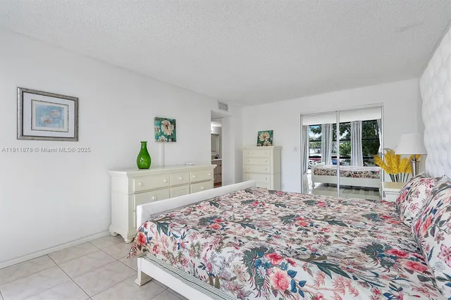 a bathroom with a double vanity sink mirror and toilet