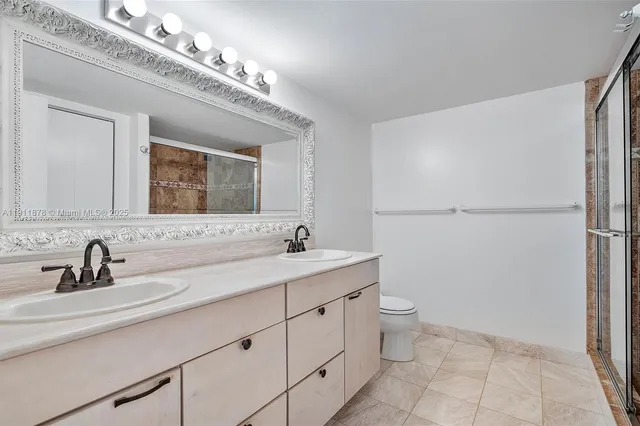 a bathroom with a sink double vanity and a mirror