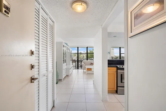 a living room with furniture and large windows