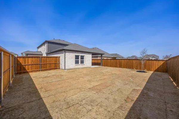 a view of a backyard of the house