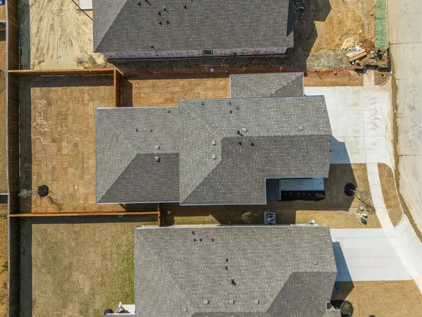 an aerial view of a house with swimming pool