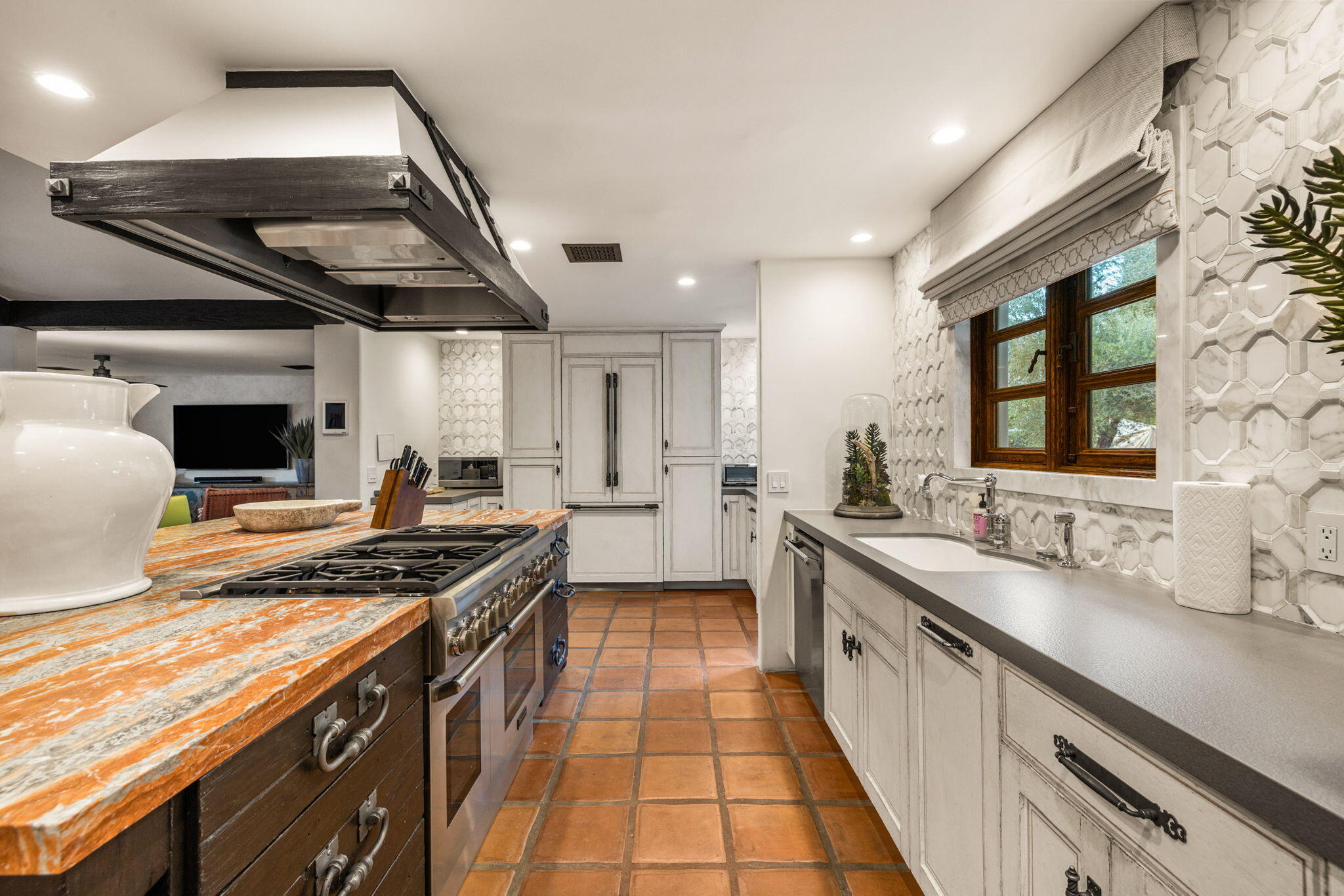 535 North Belardo Road Palm Springs, CA 92262 - Photo 14 of 45 a kitchen with stainless steel appliances granite countertop a stove and a sink