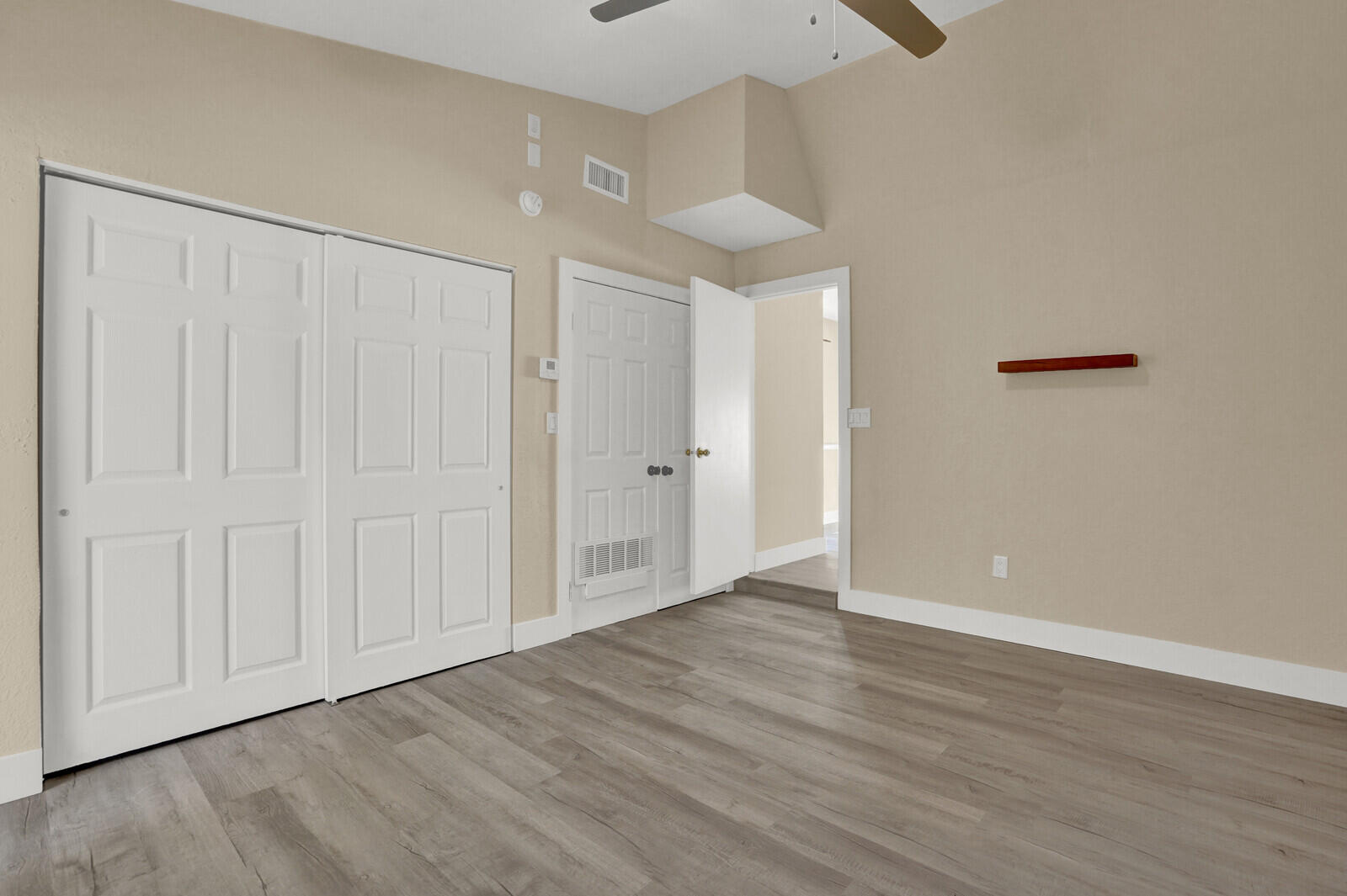 101 Northwest 9th Street Boca Raton, FL 33432 - Photo 17 of 35 a view of an empty room with wooden floor