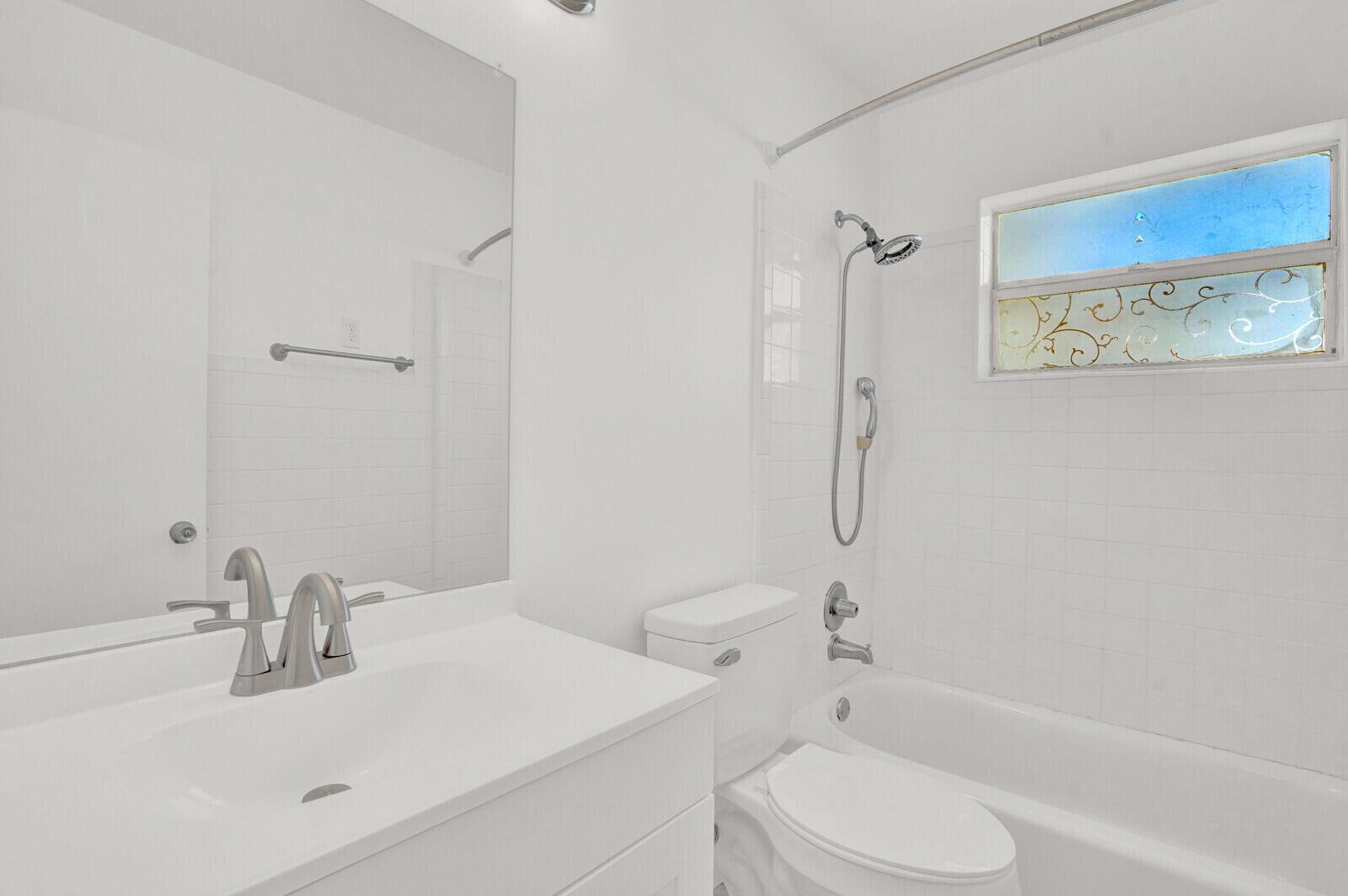 101 Northwest 9th Street Boca Raton, FL 33432 - Photo 23 of 35 a bathroom with a sink toilet and shower