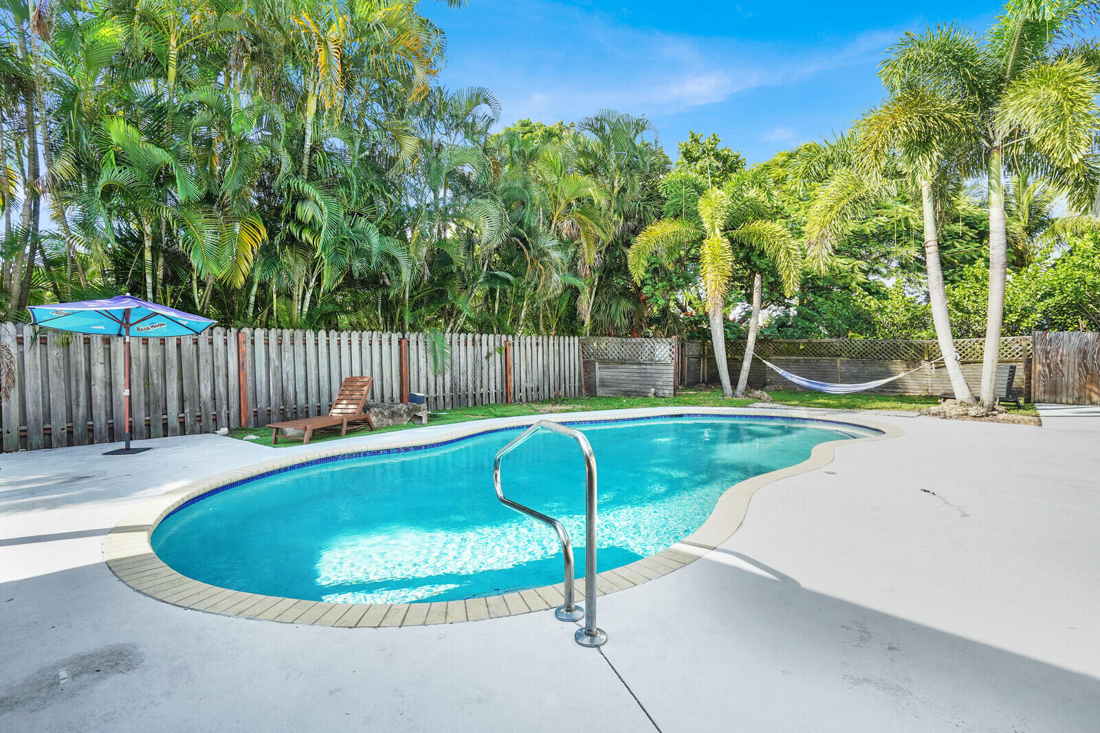 101 Northwest 9th Street Boca Raton, FL 33432 - Photo 24 of 35 a view of a swimming pool with a patio