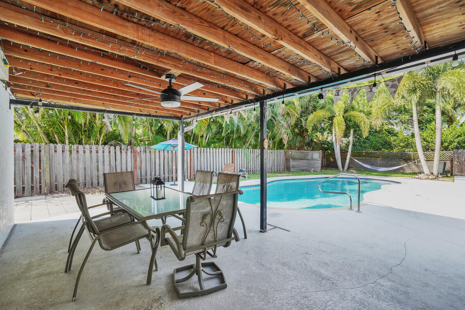 101 Northwest 9th Street Boca Raton, FL 33432 - Photo 25 of 35 a view of patio with a table chairs and a slide