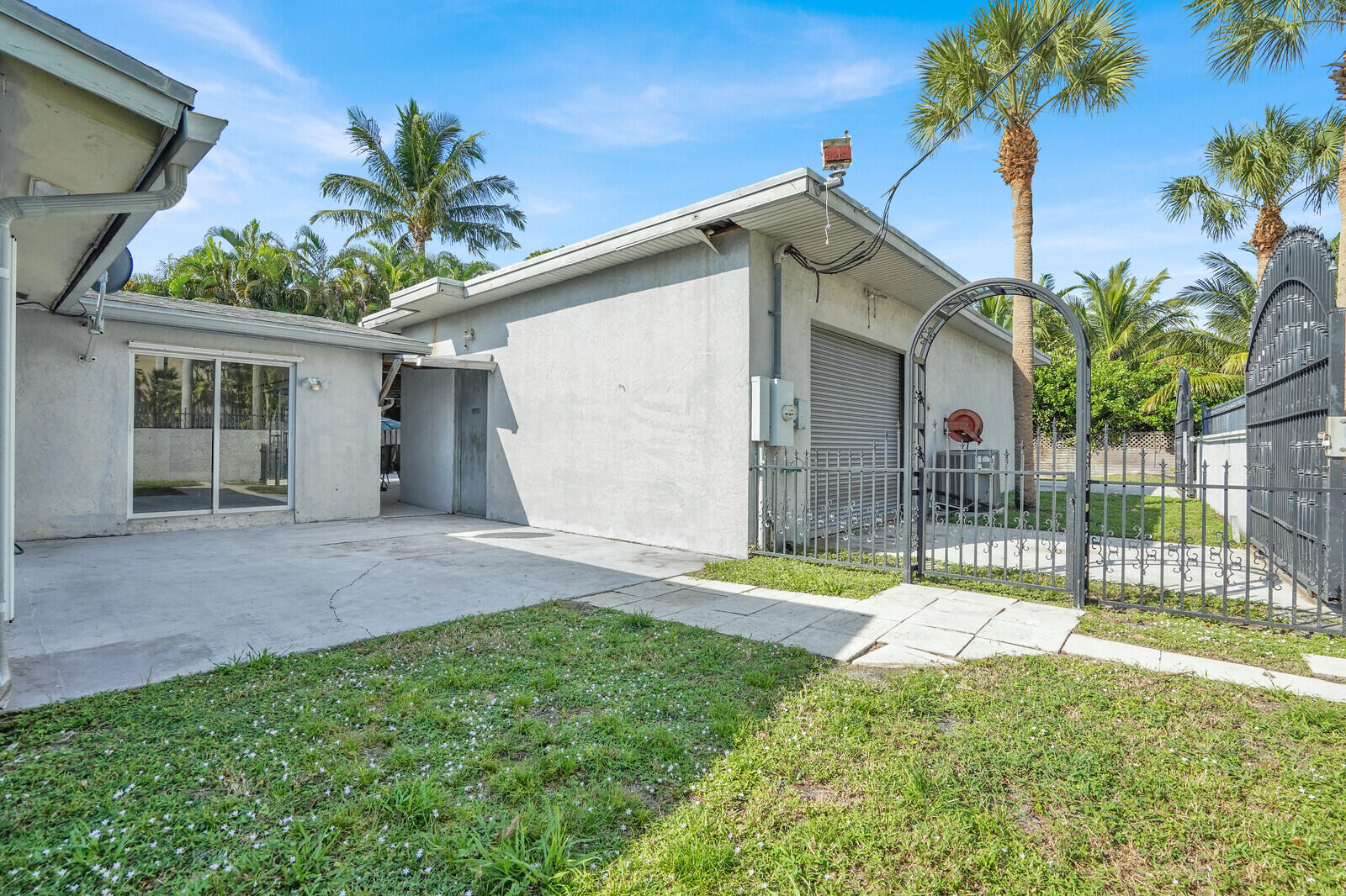 101 Northwest 9th Street Boca Raton, FL 33432 - Photo 27 of 35 a view of a house with a yard and potted plants
