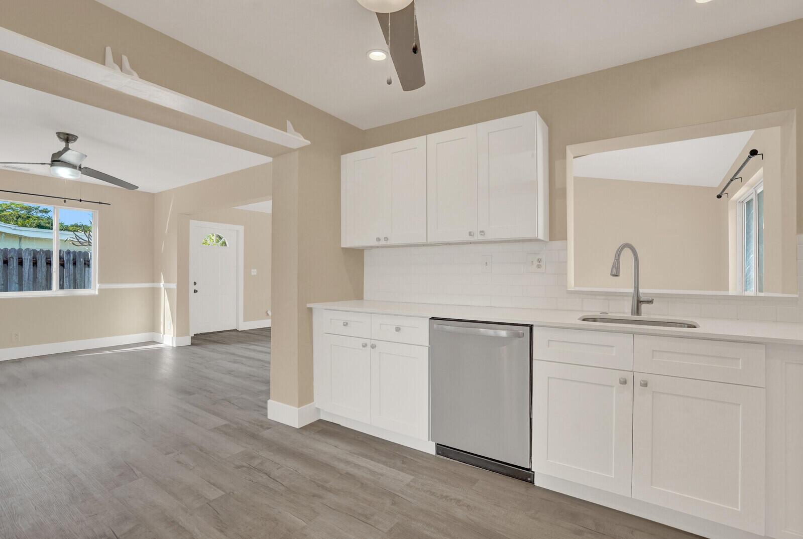 101 Northwest 9th Street Boca Raton, FL 33432 - Photo 10 of 35 a kitchen with granite countertop white cabinets and a sink