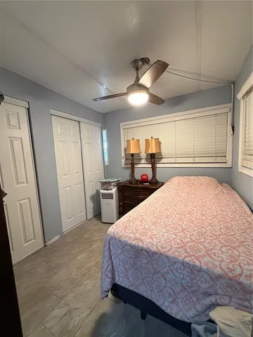 a bed room with a bed and a television