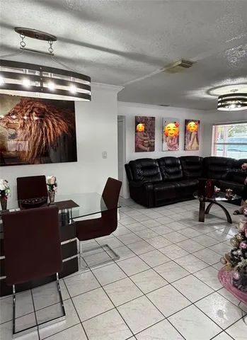 a view of kitchen with furniture and window