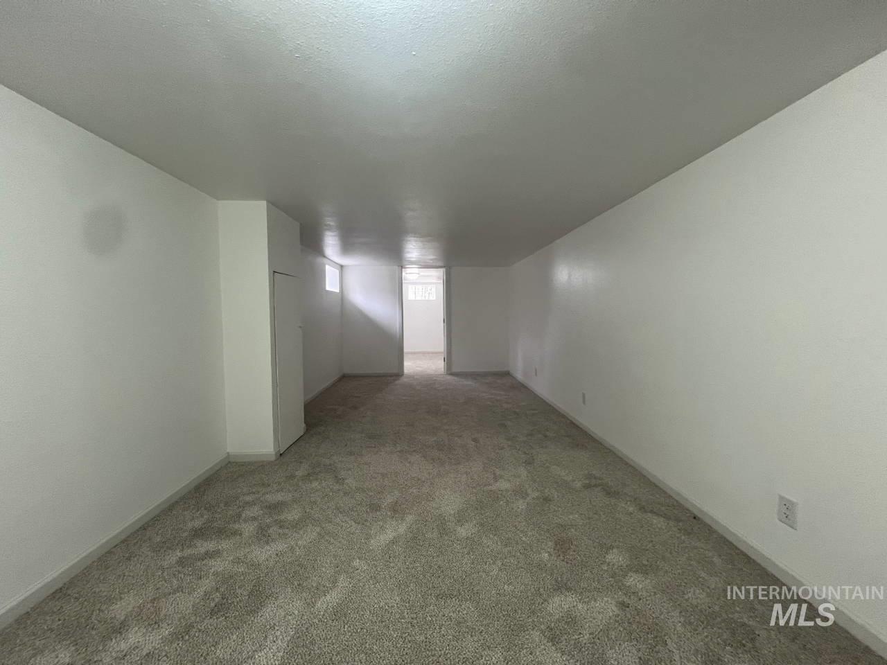 905 West Adams Street Garfield, WA 99130 - Photo 12 of 19 Carpeted spare room with baseboards and a textured ceiling