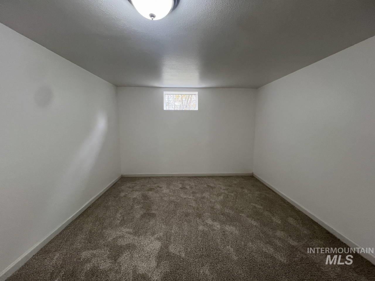 905 West Adams Street Garfield, WA 99130 - Photo 14 of 19 Below grade area with carpet floors and a textured ceiling