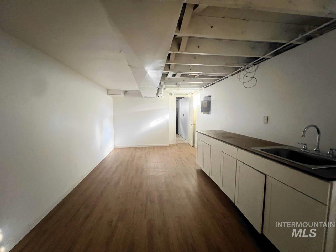 905 West Adams Street Garfield, WA 99130 - Photo 15 of 19 Hallway featuring dark wood-style flooring and electric panel