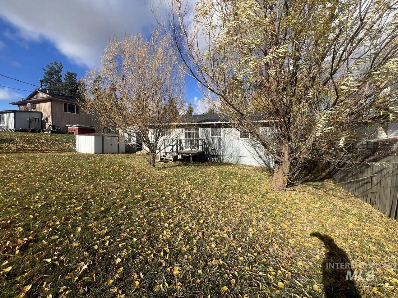 905 West Adams Street Garfield, WA 99130 - Photo 19 of 19 Back of property featuring a lawn and a storage unit