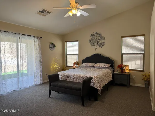 a bedroom with a bed and window