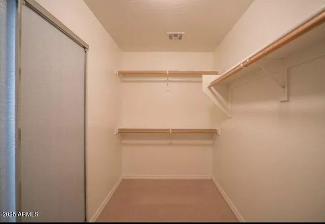 a view of walk in closet with window