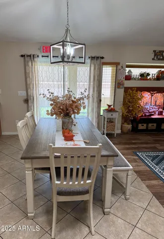 a view of a dining room with furniture and window