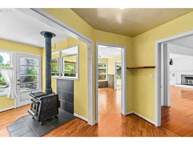 a living room with furniture and a floor to ceiling window