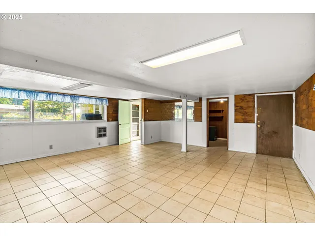 a view of a living room and bathroom