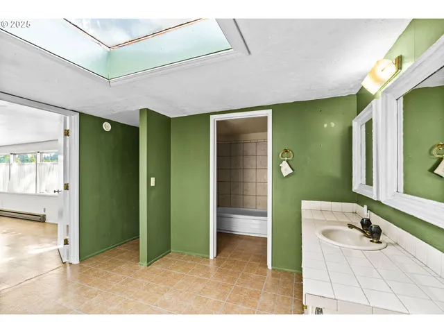 a bathroom with a double vanity sink and a mirror